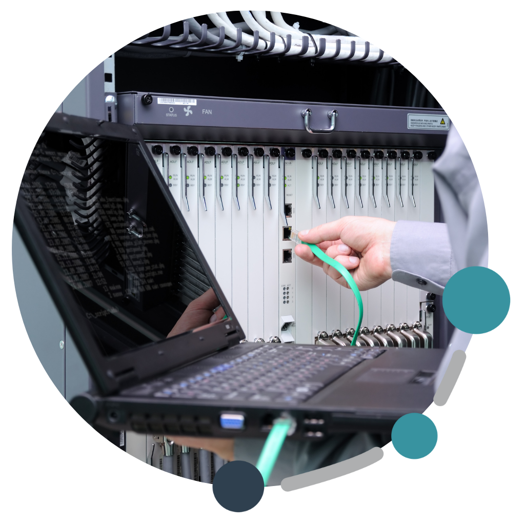 Technician connects laptop to server