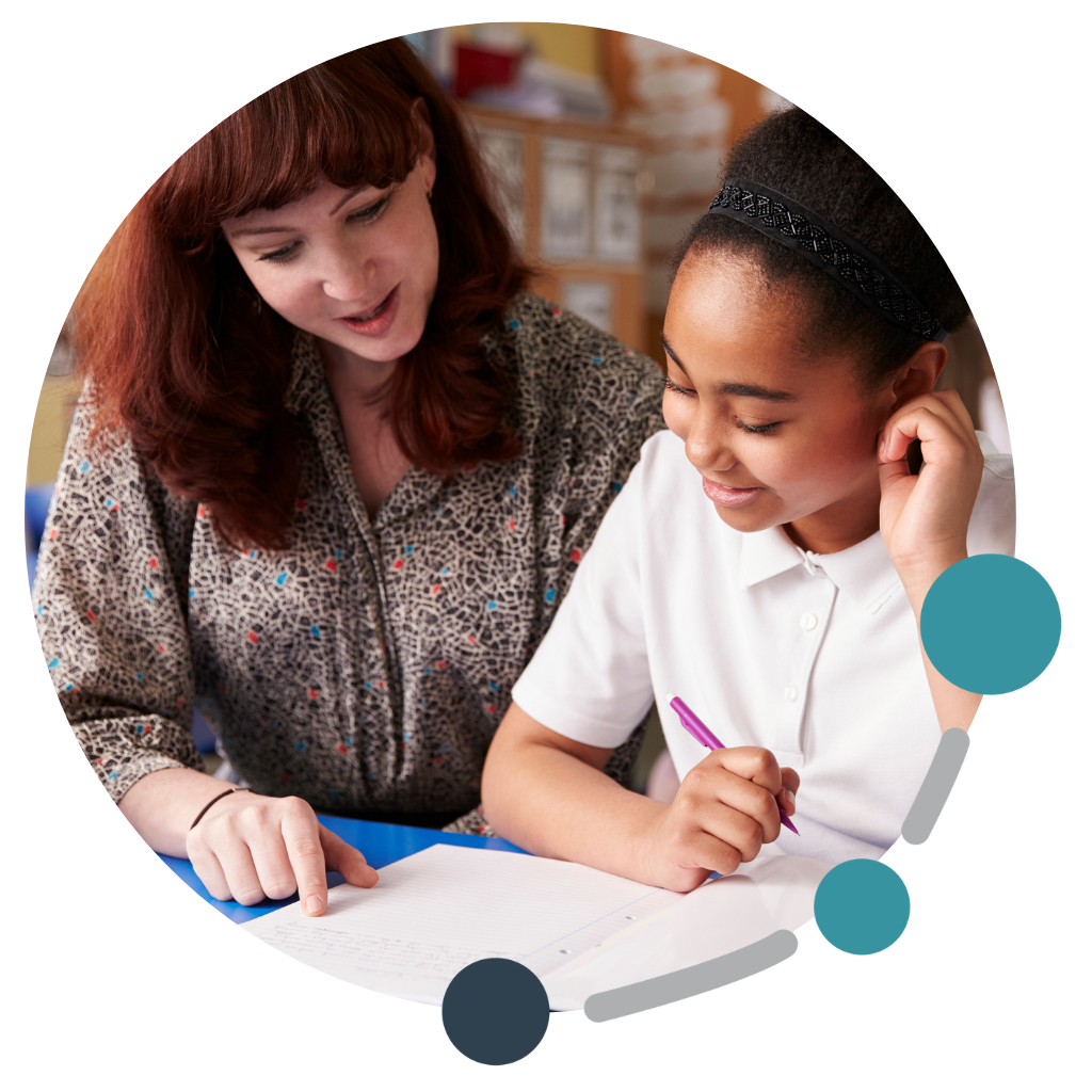 Teacher and student looking at a document