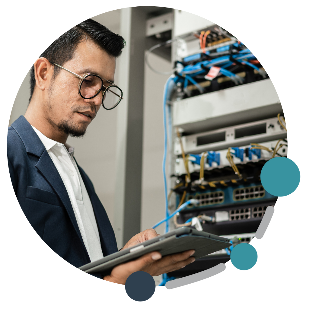 Technician holding tablet working on server